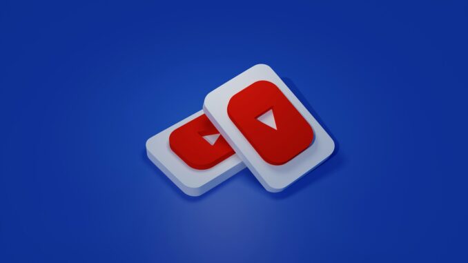 YouTube une paire de boutons de lecture blancs et rouges sur fond bleu